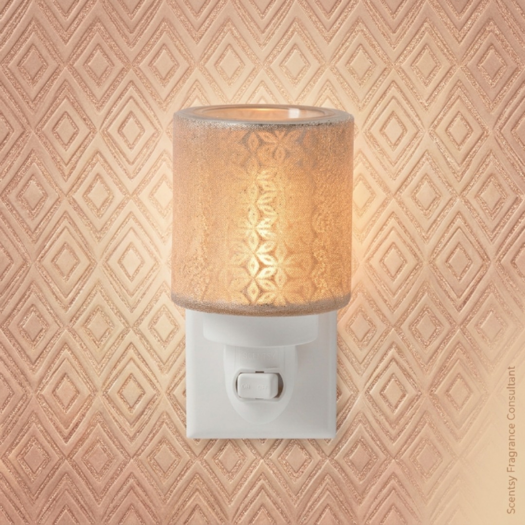 A little glam goes a long way 💎 Meet the Fancy Filigree Mini Warmer

Laser cut pattern with shimmering glass beads, casting a warm glowing sparkle wherever you put it

Simple and understated or full glam, what's your style?

#homedecor #miniwarmer #janicaspamperedlife #scentsy